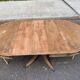 Round extendable dining table Regency central leg stripped mahogany 1960