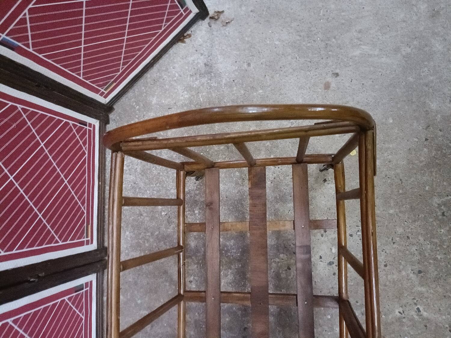 Old small bed or cradle for baby in vintage rattan