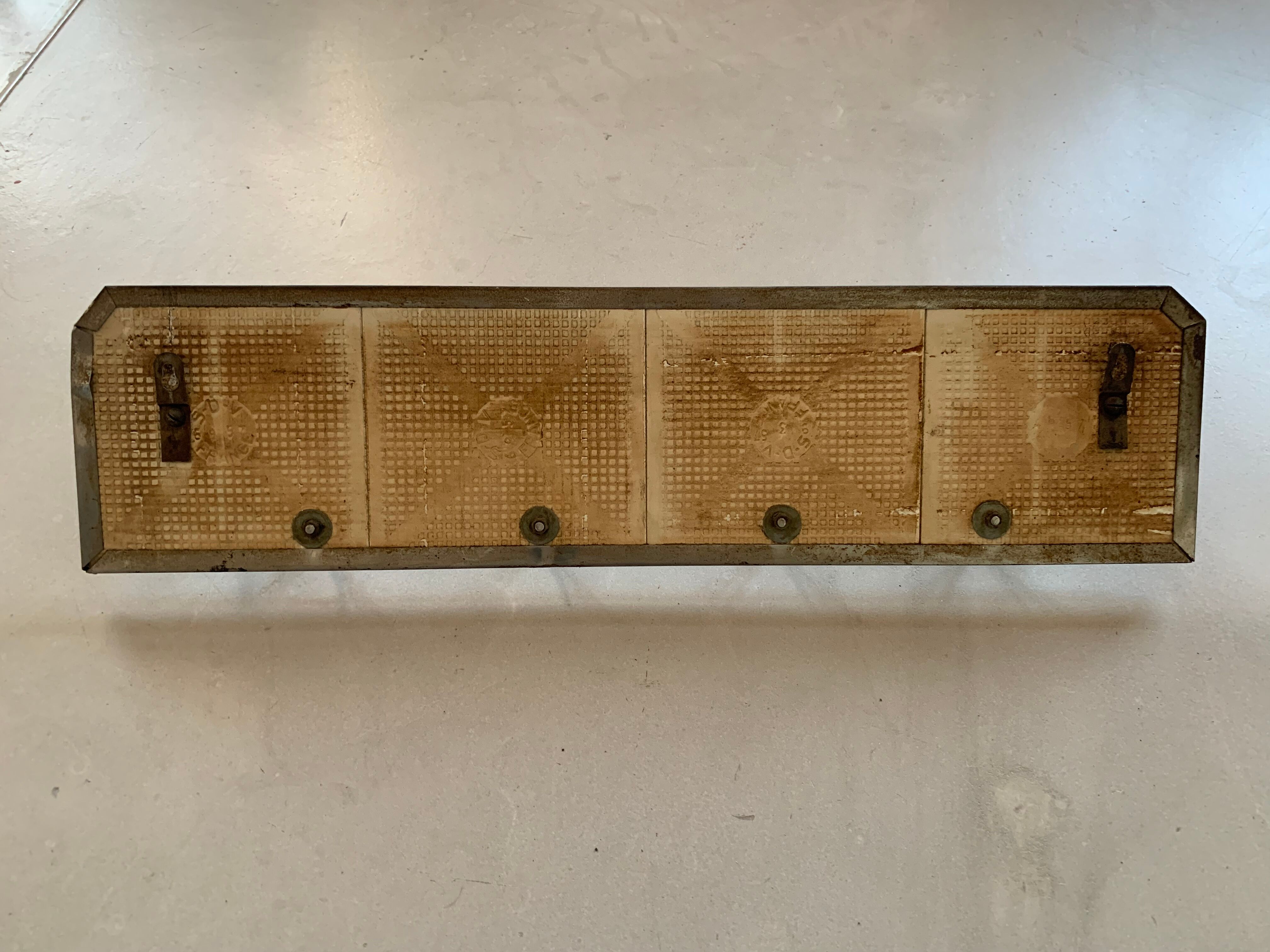 Antique tiled tea towel holder