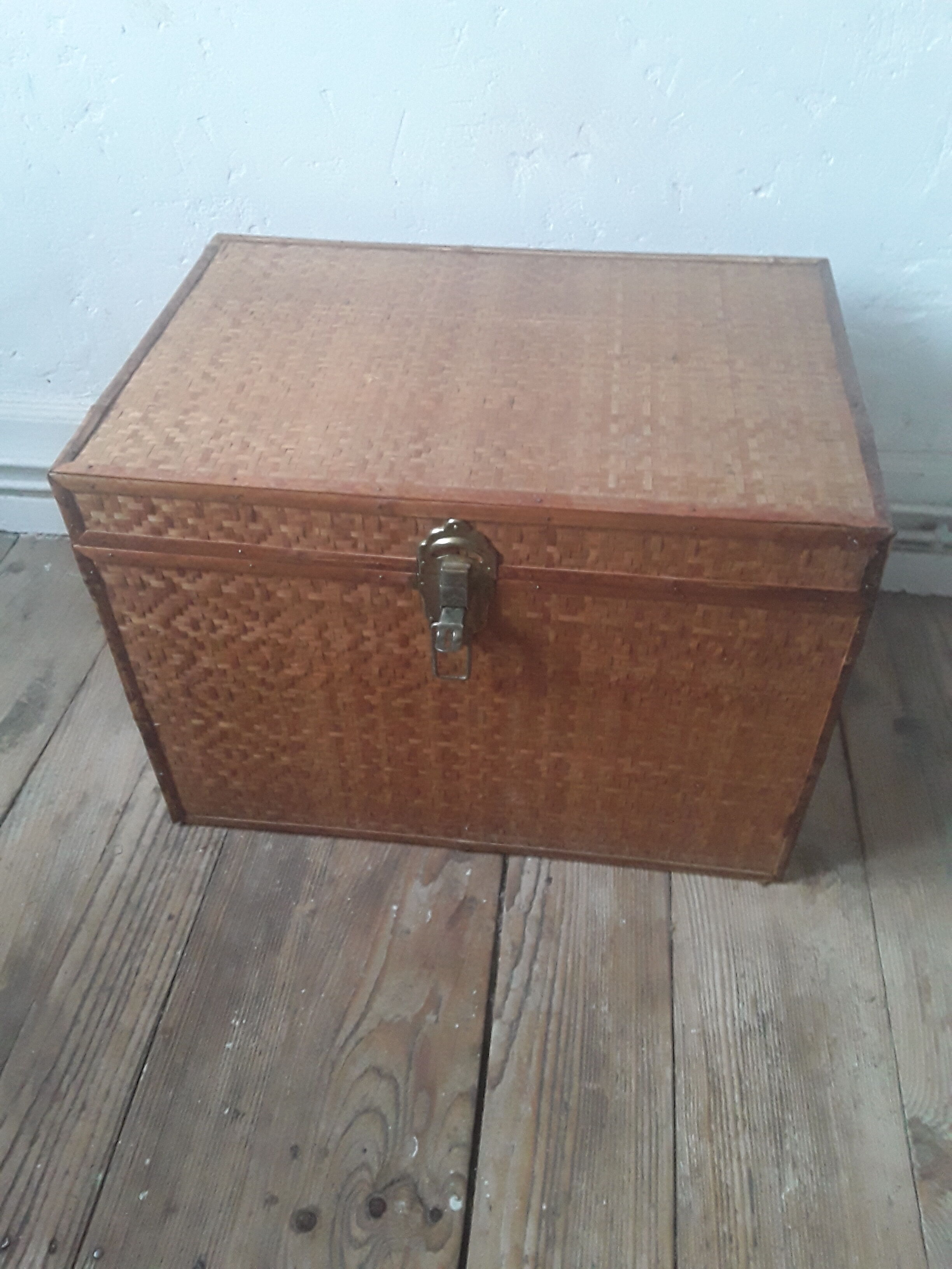 Wooden trunk with braiding