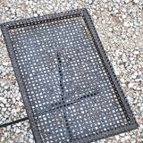 Side table in black perforated metal rigitulle from the 50s