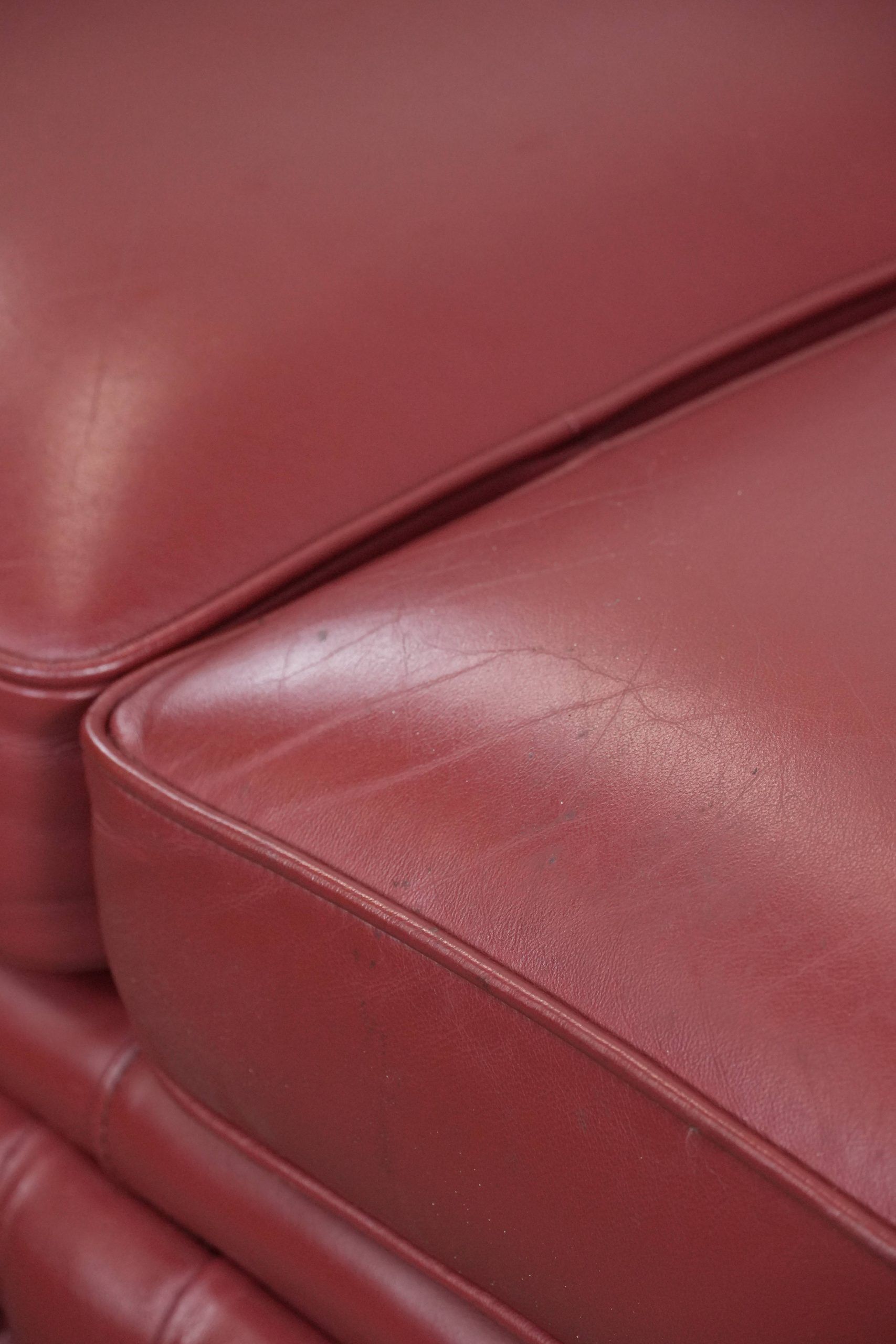 English cowhide Chesterfield 2.5-seater sofa in a stunning red colour