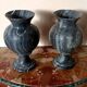 Pair of black serpentine marble vase-urns, early 20th century, Empire style