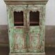 Armoire vitrée patinée verte