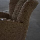 Pair of Danish Art Deco modern lounge chairs in sheepskin with lambswool and elm, 1940s.