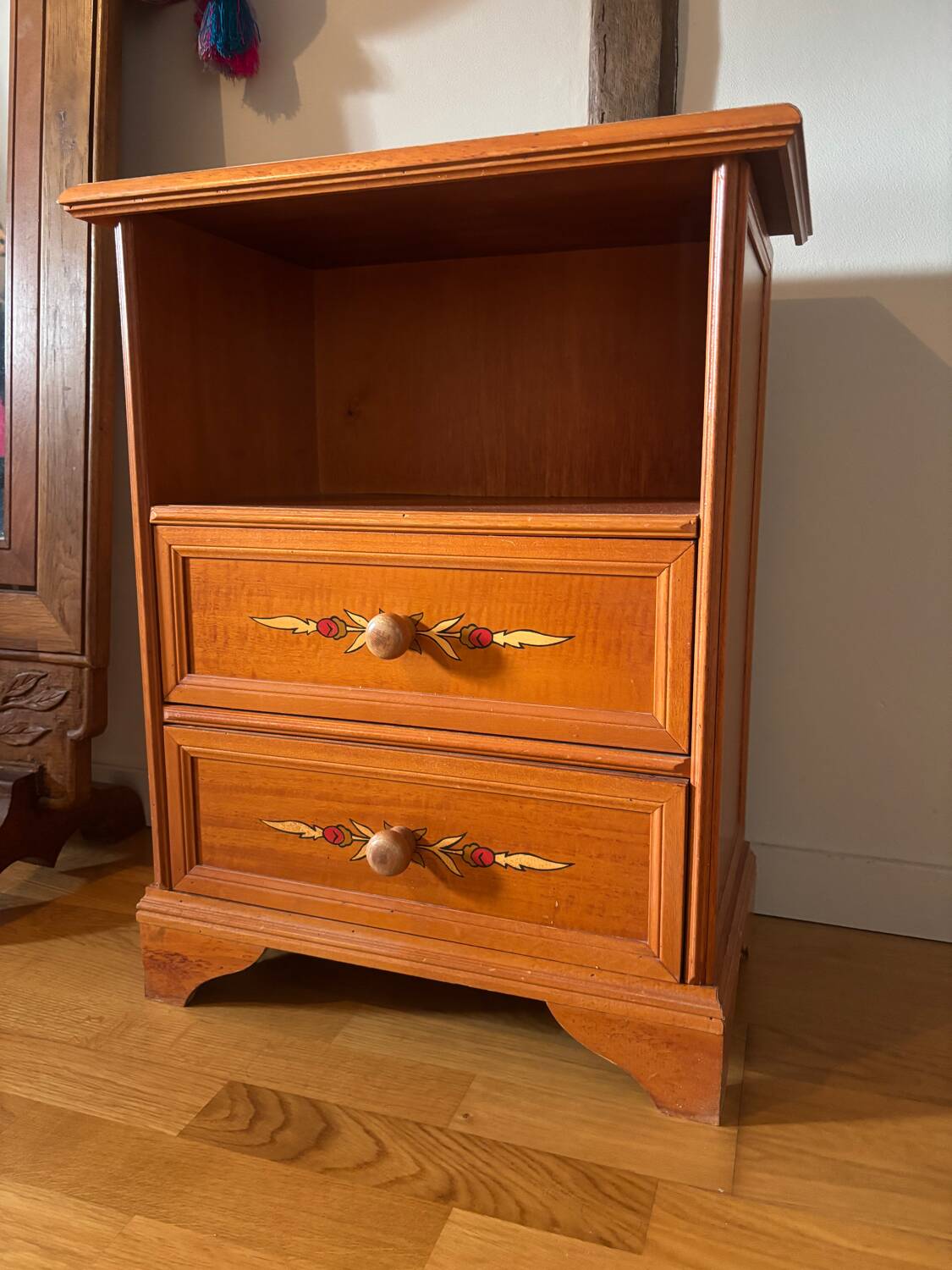Vintage bedside table with floral decor