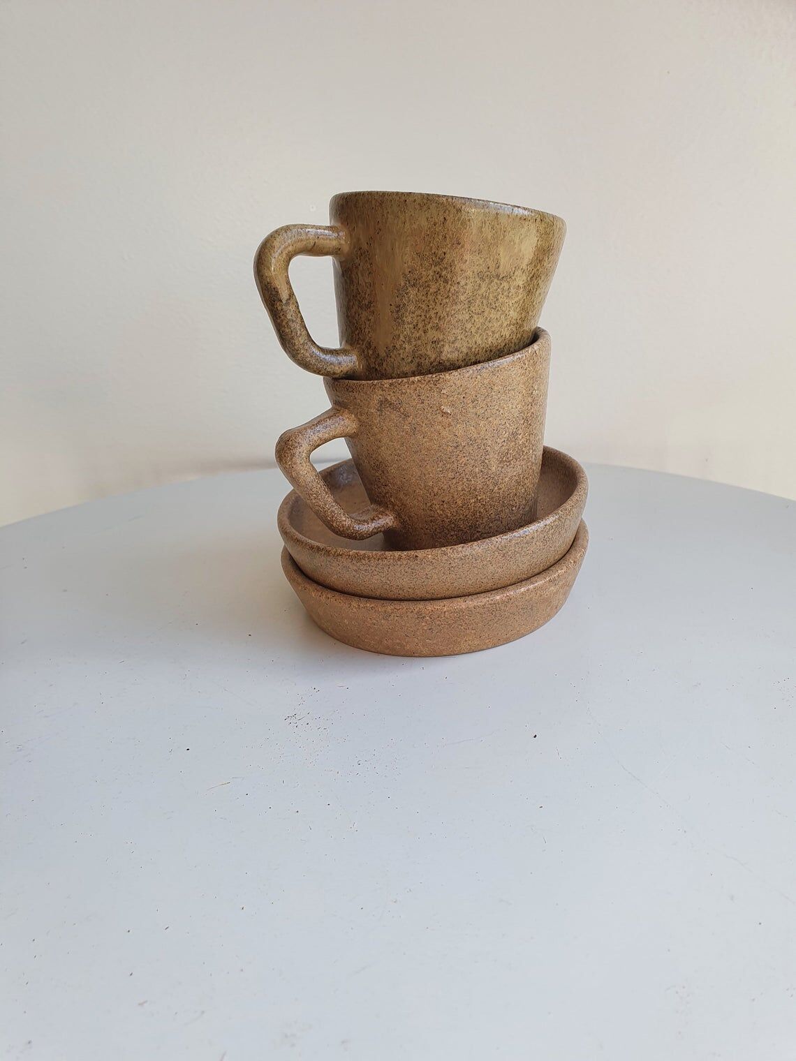 Lot of 2 cups and saucers in sandstone