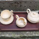 Former breakfast service at the earthenware bed with tray