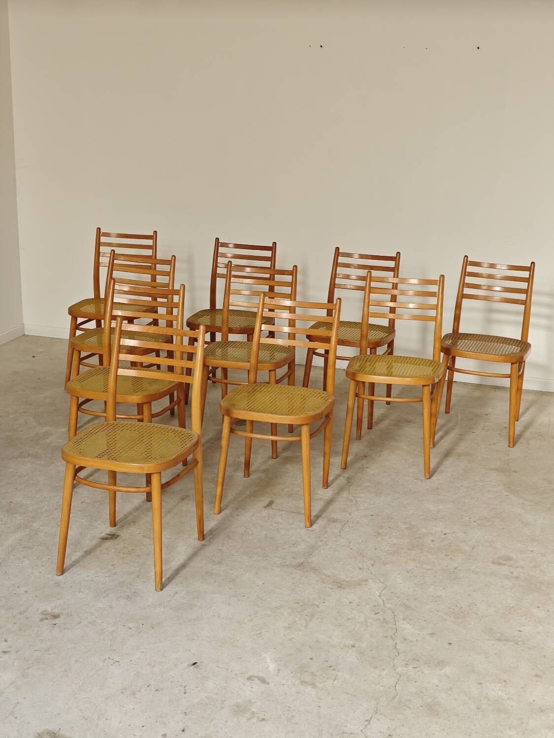 Set of 10 Bystrice tone wooden and caned chairs from the 1960s.