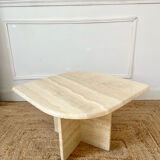 Travertine coffee table in eye shape.