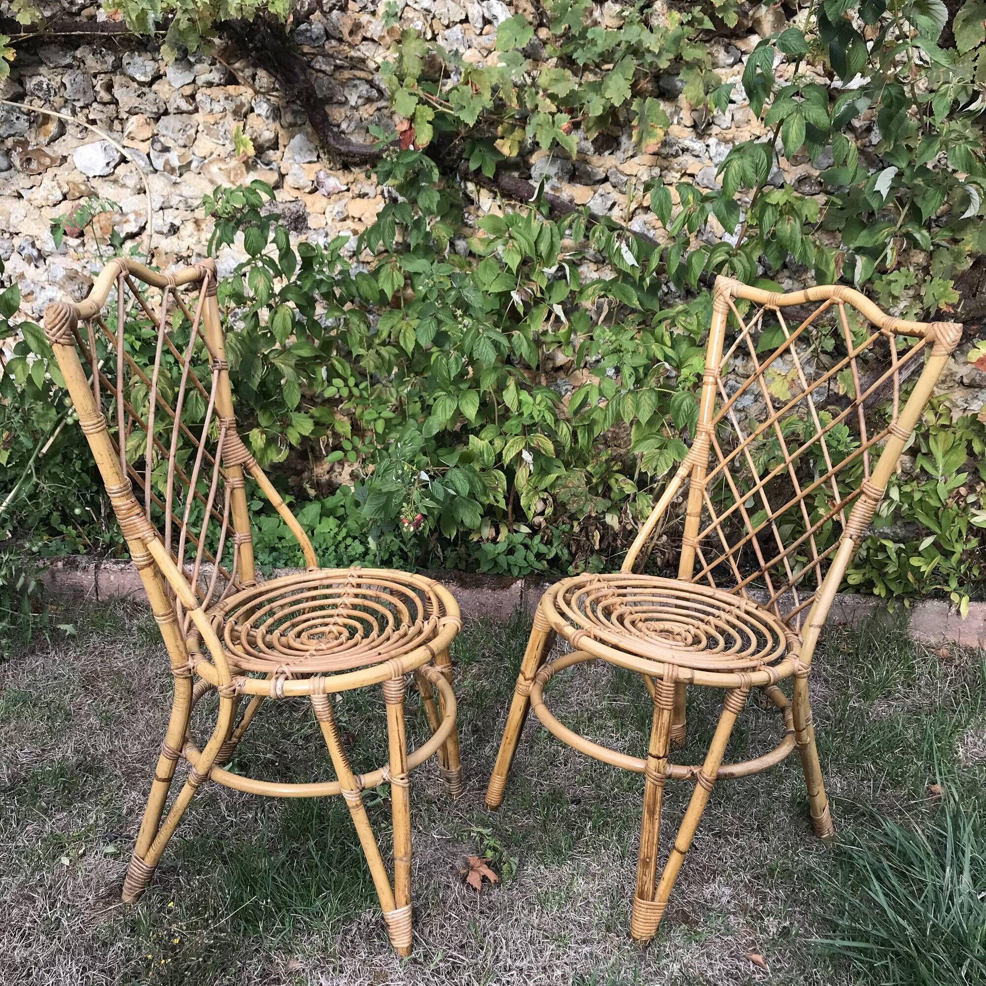 Pair of Louis Sognot chairs in vintage rattan 1960