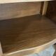 A bedside table with a drawer and a niche in Louis XV style.