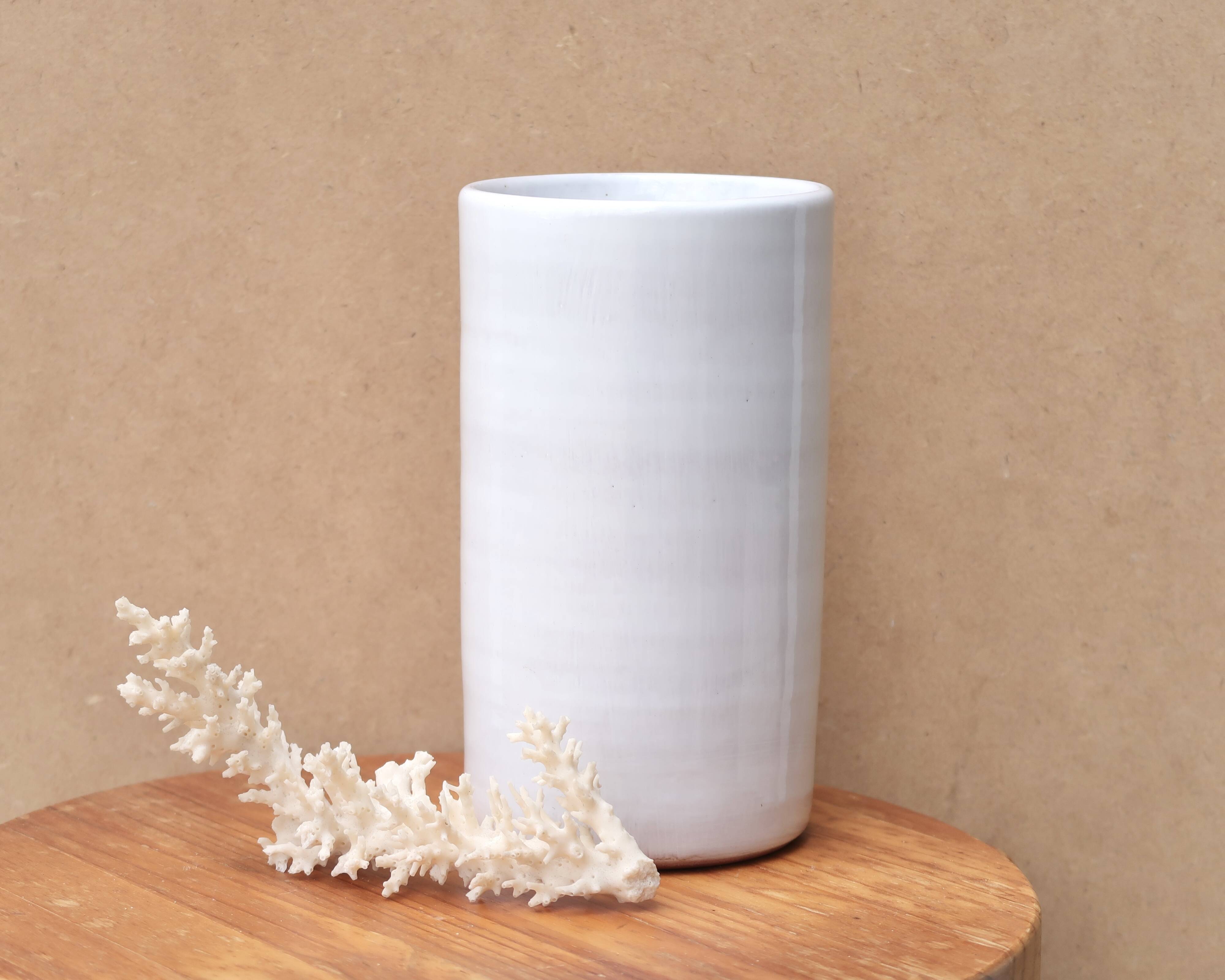 Vase by Antonio Lampecco minimalist white ceramic scroll
