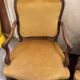 Pair of faux Louis XV armchairs in fully carved walnut