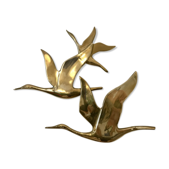 Birds in brass flight