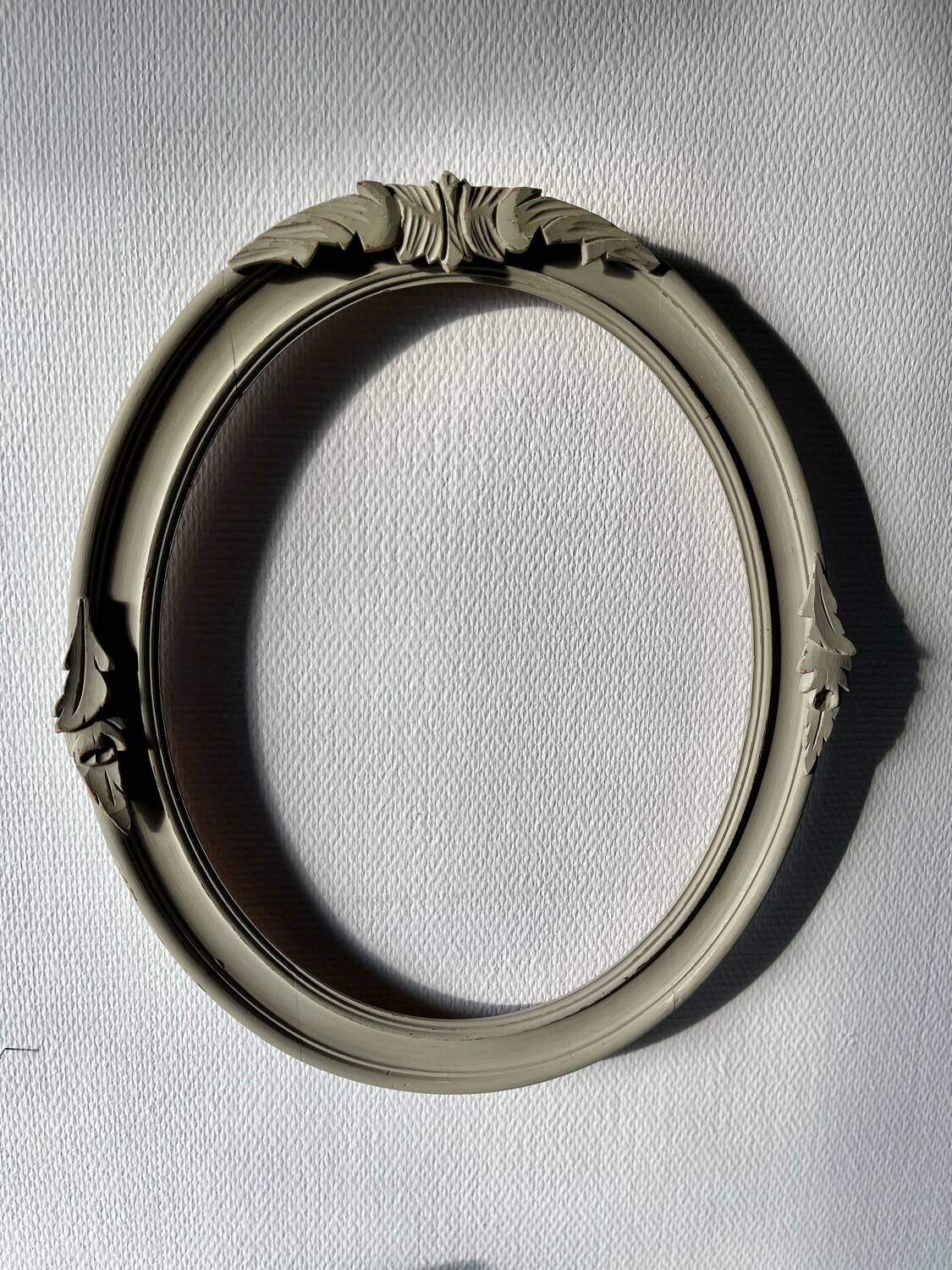 Oval frame in weathered wood