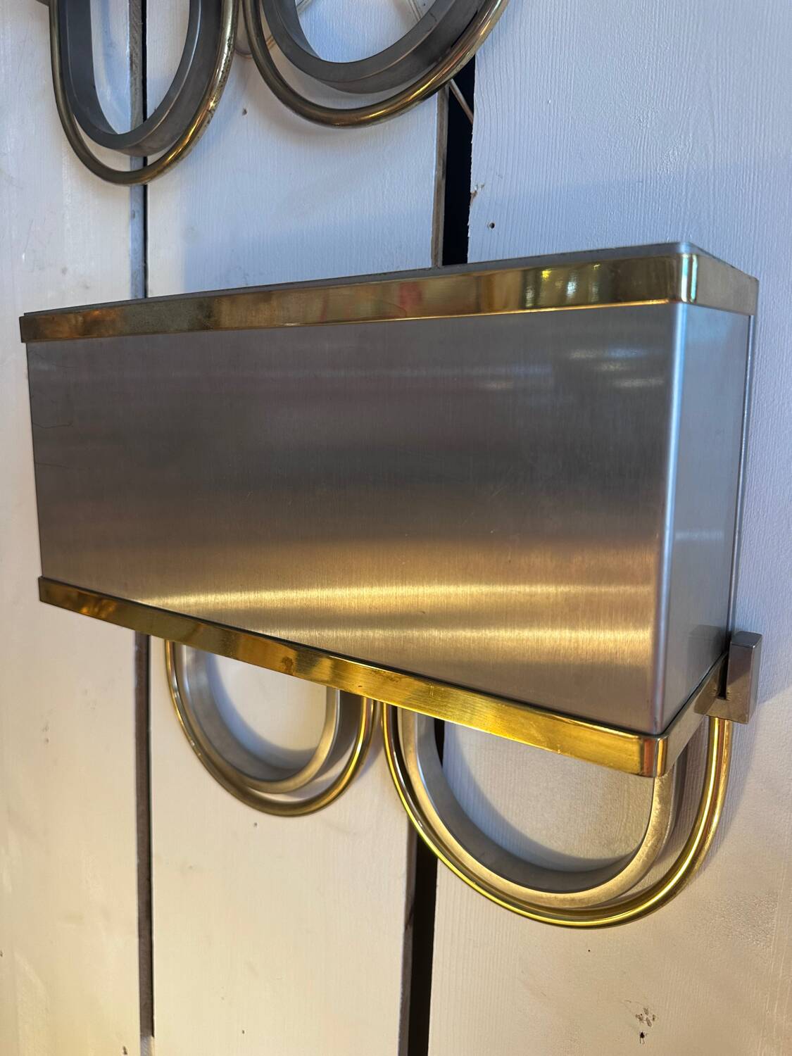 Pair of stainless steel and brass wall lights