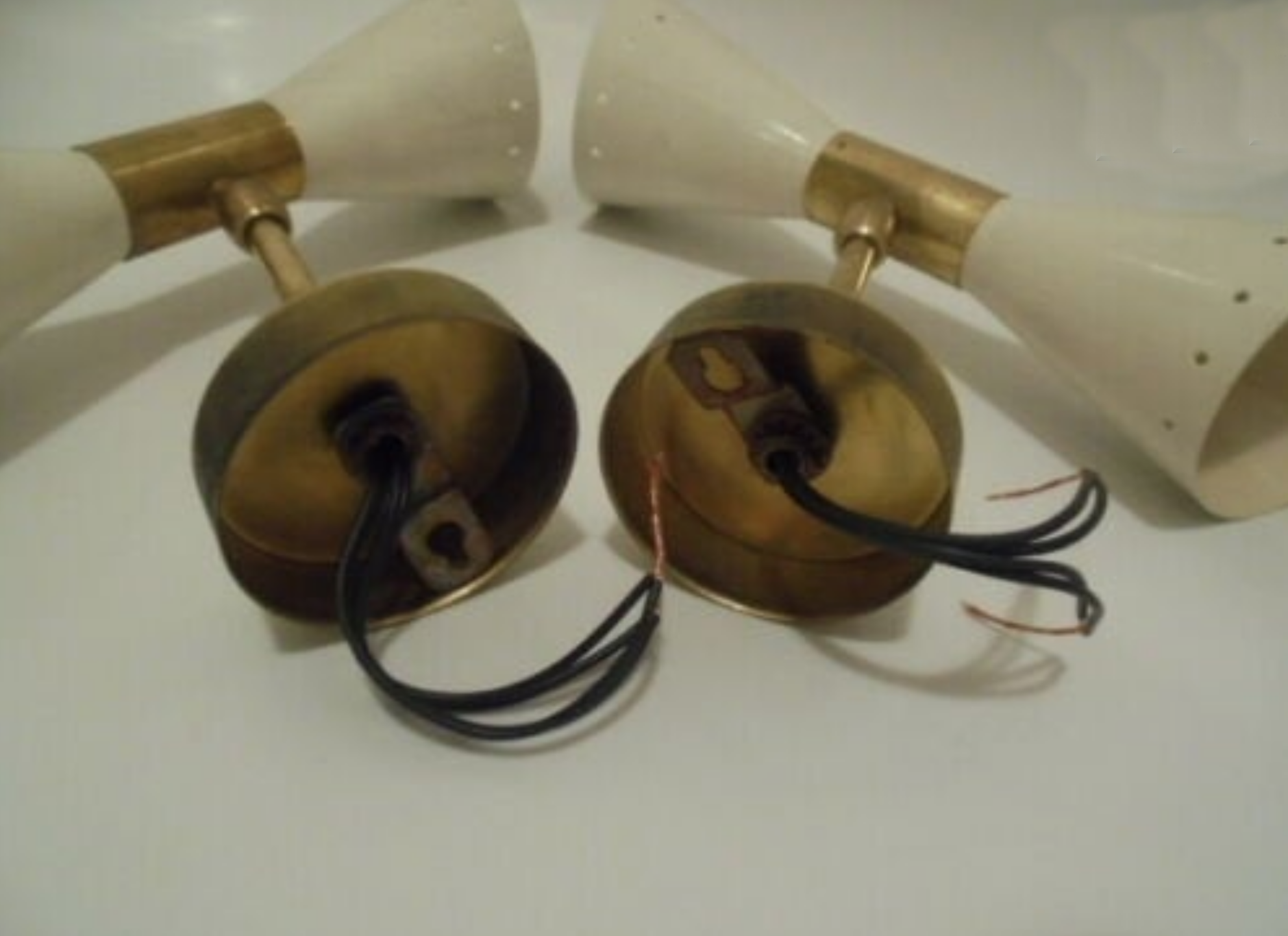 Pair of wall sconces remembering the Italian creations from the 50s and 60's