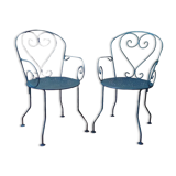 A pair of metal garden chairs