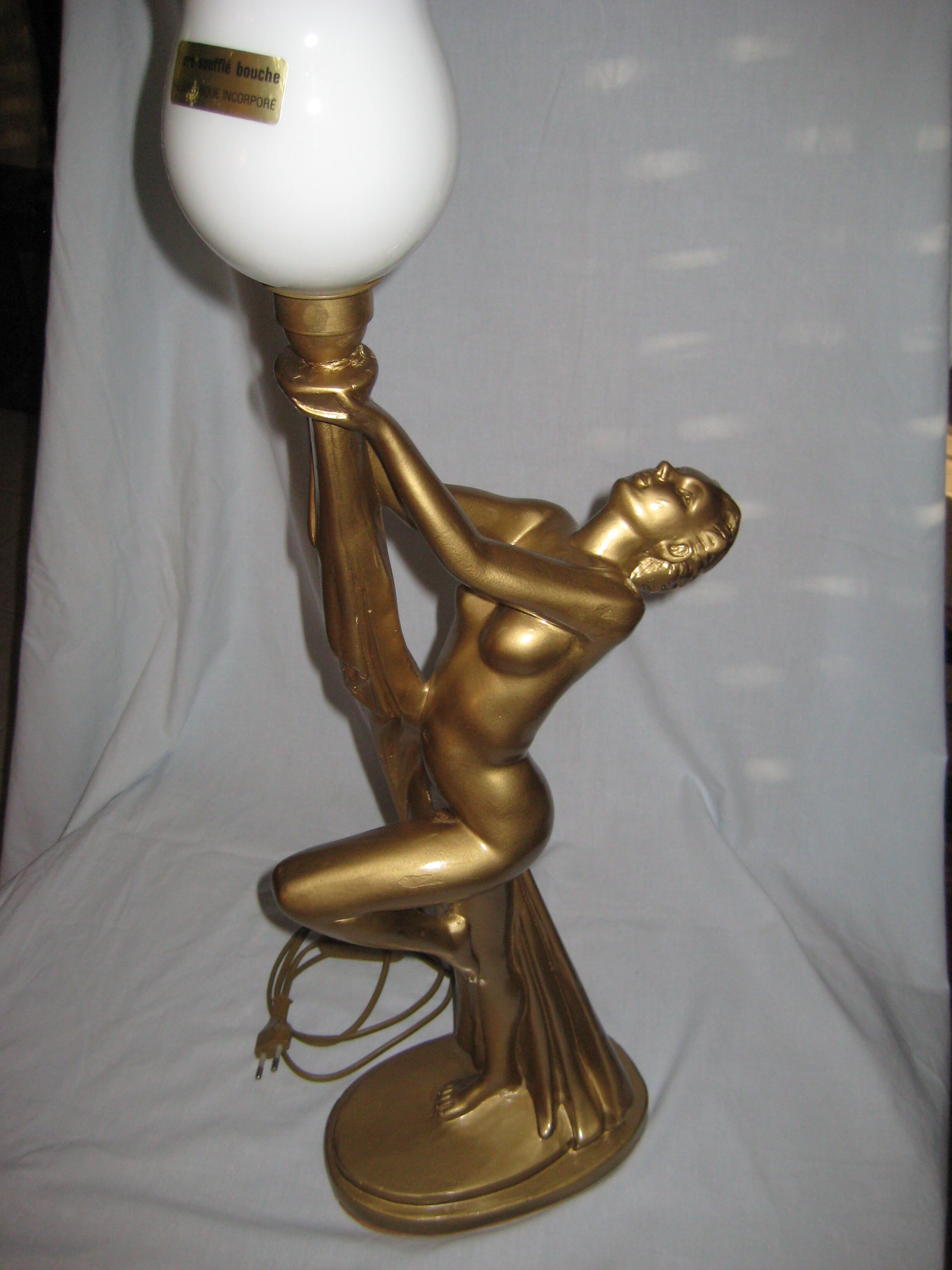 Lamp depicting a with a drape