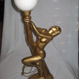 Lamp depicting a with a drape