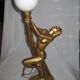 Lamp depicting a with a drape