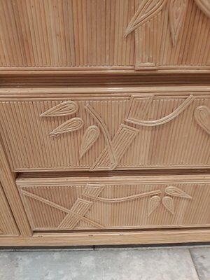 Vintage wicker sideboard with flowers