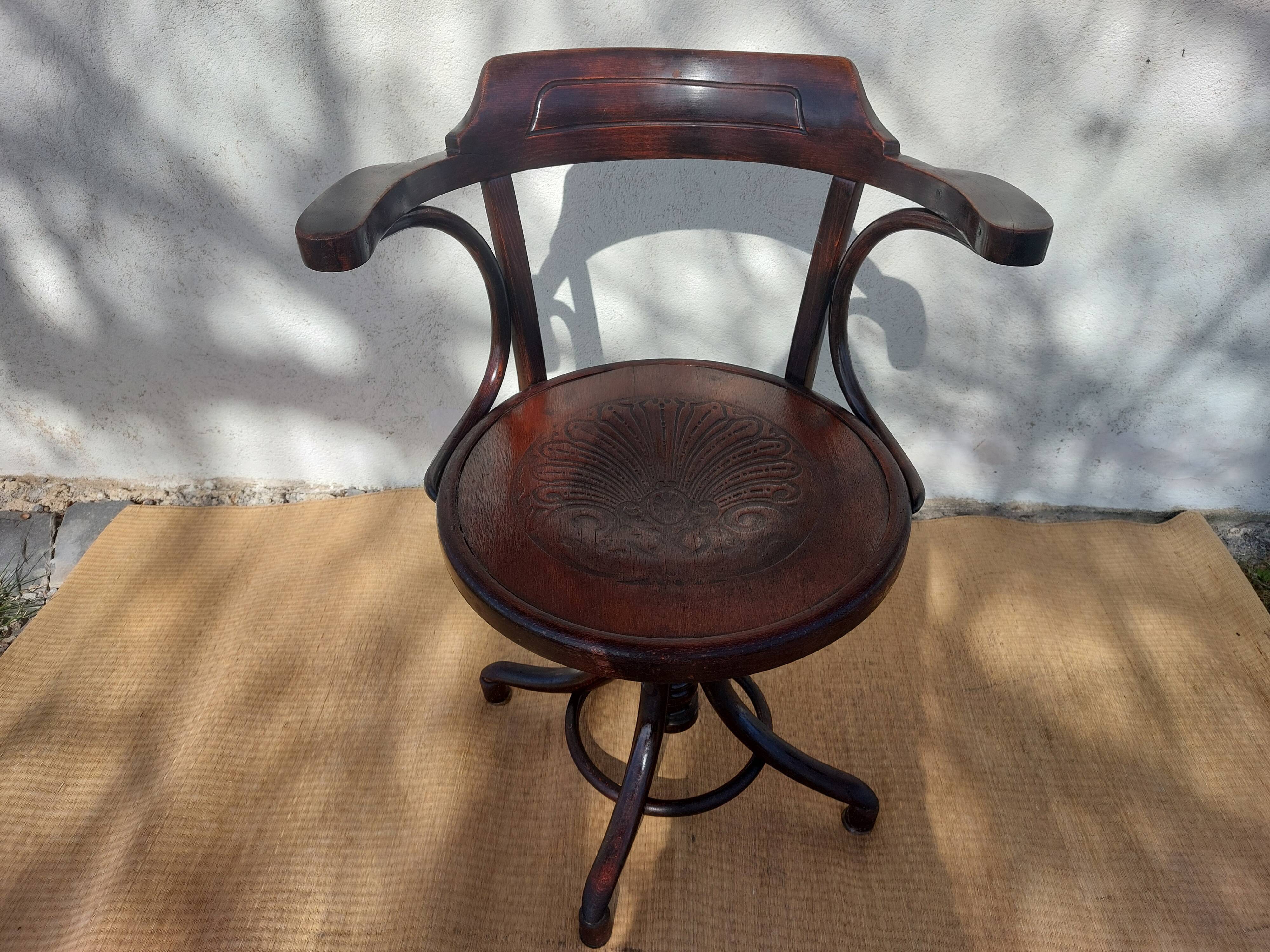 Swivel wooden armchair, pattern on seat