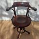 Swivel wooden armchair, pattern on seat