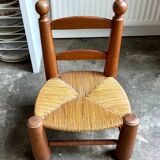 Brutalist low chair in dark wood and straw no. 3