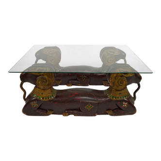 Hollywood Regency coffee table with carved wooden rams, circa 1970