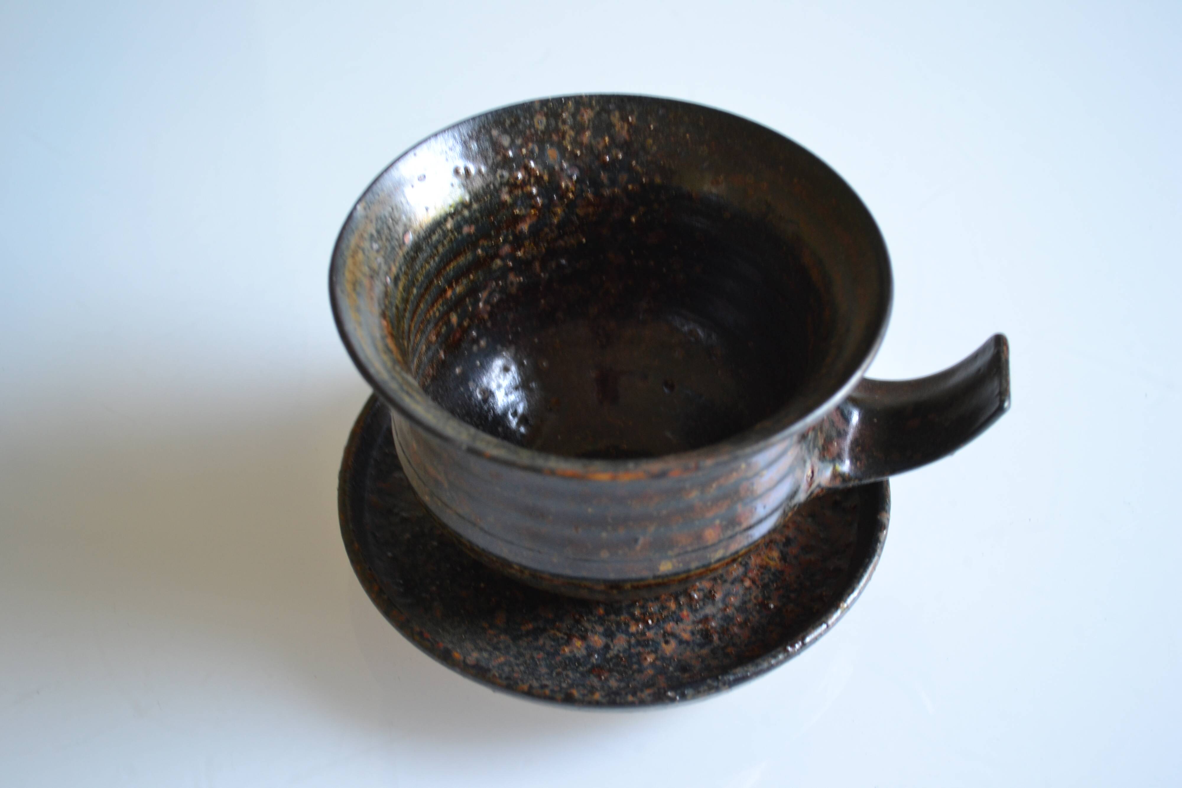 1970s ceramic cup and saucer signed