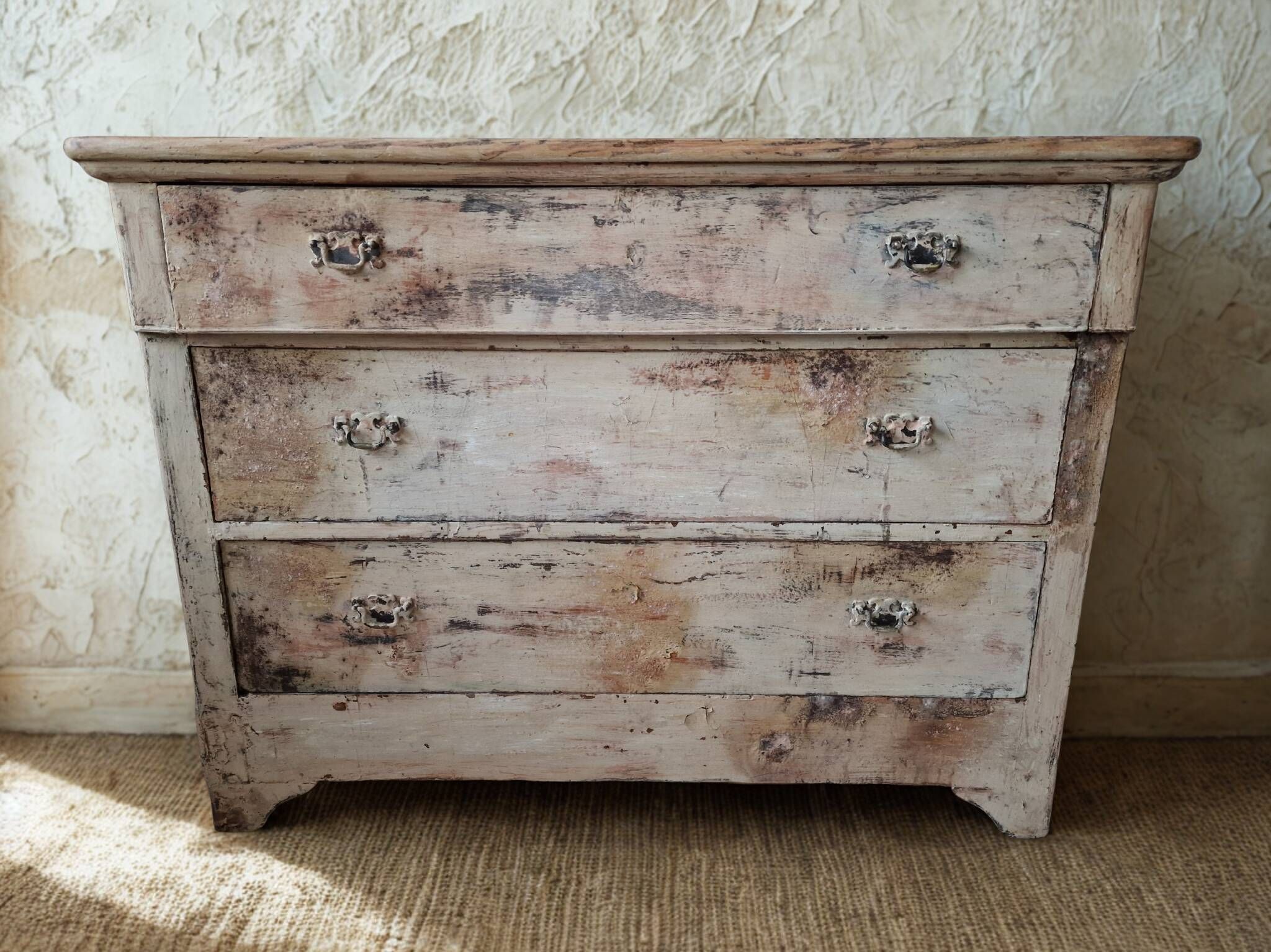 Antique patinated chest of drawers