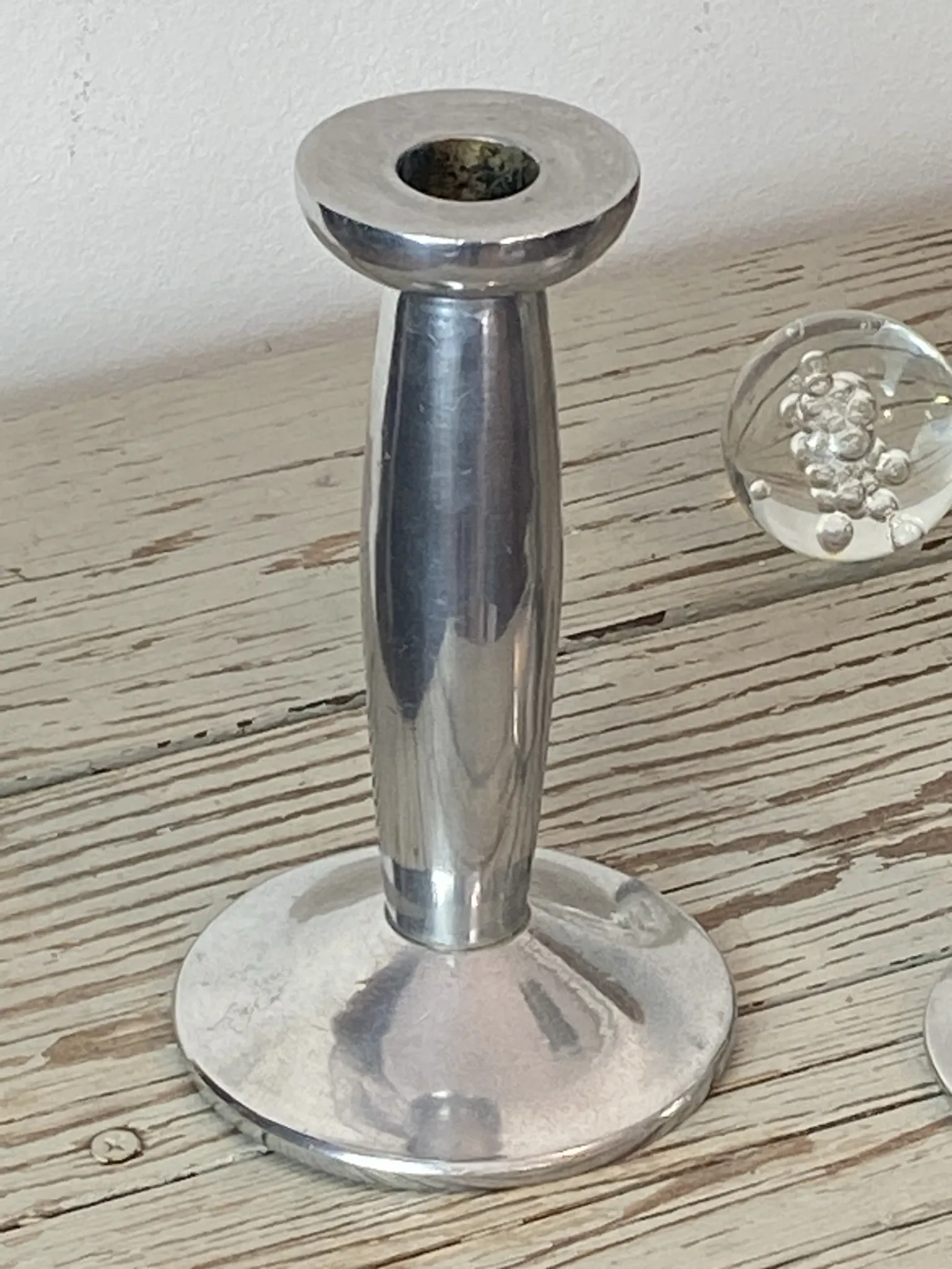 Pair of minimalist polished aluminium candle holders