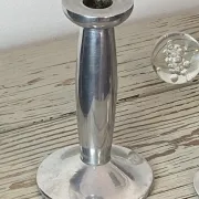 Pair of minimalist polished aluminium candle holders