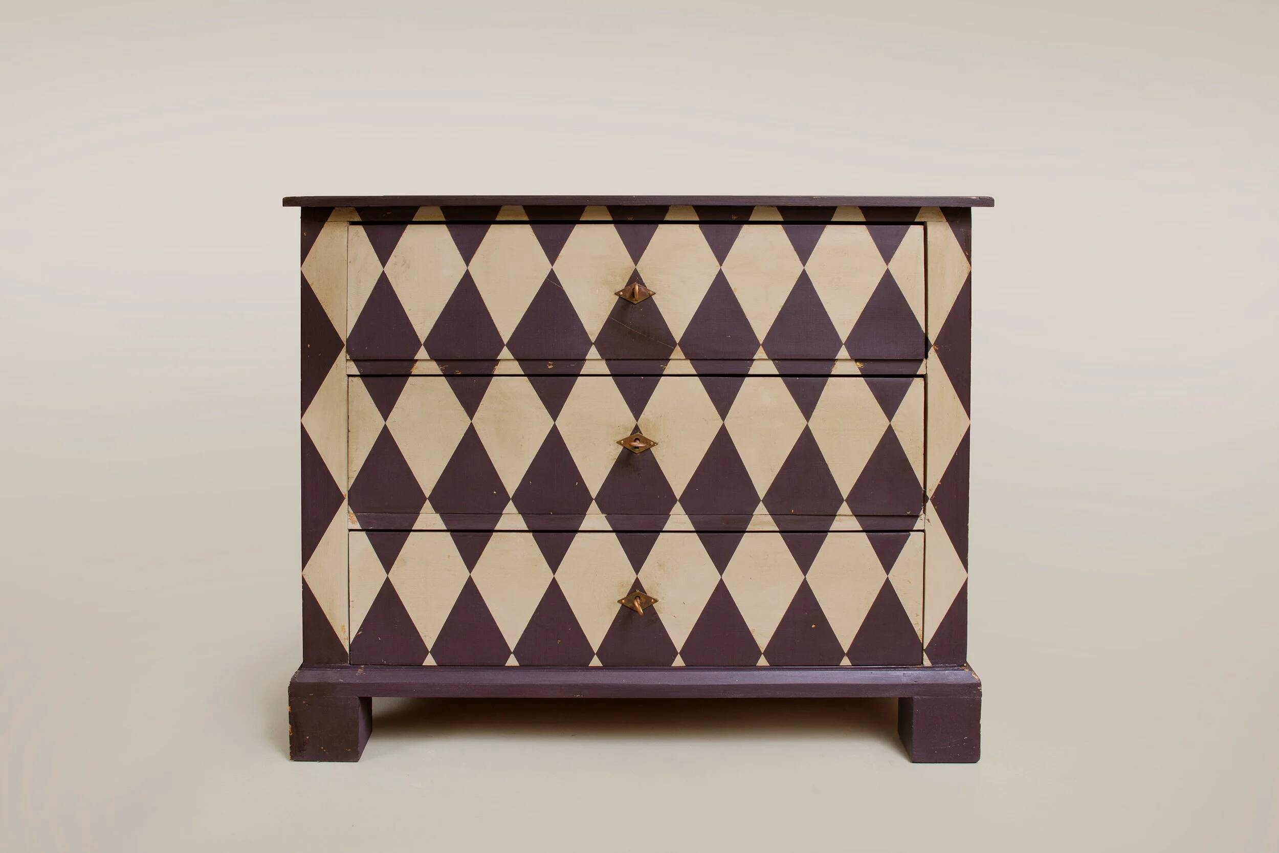 Pine chest of drawers from the 1940s with recent decorative paint.