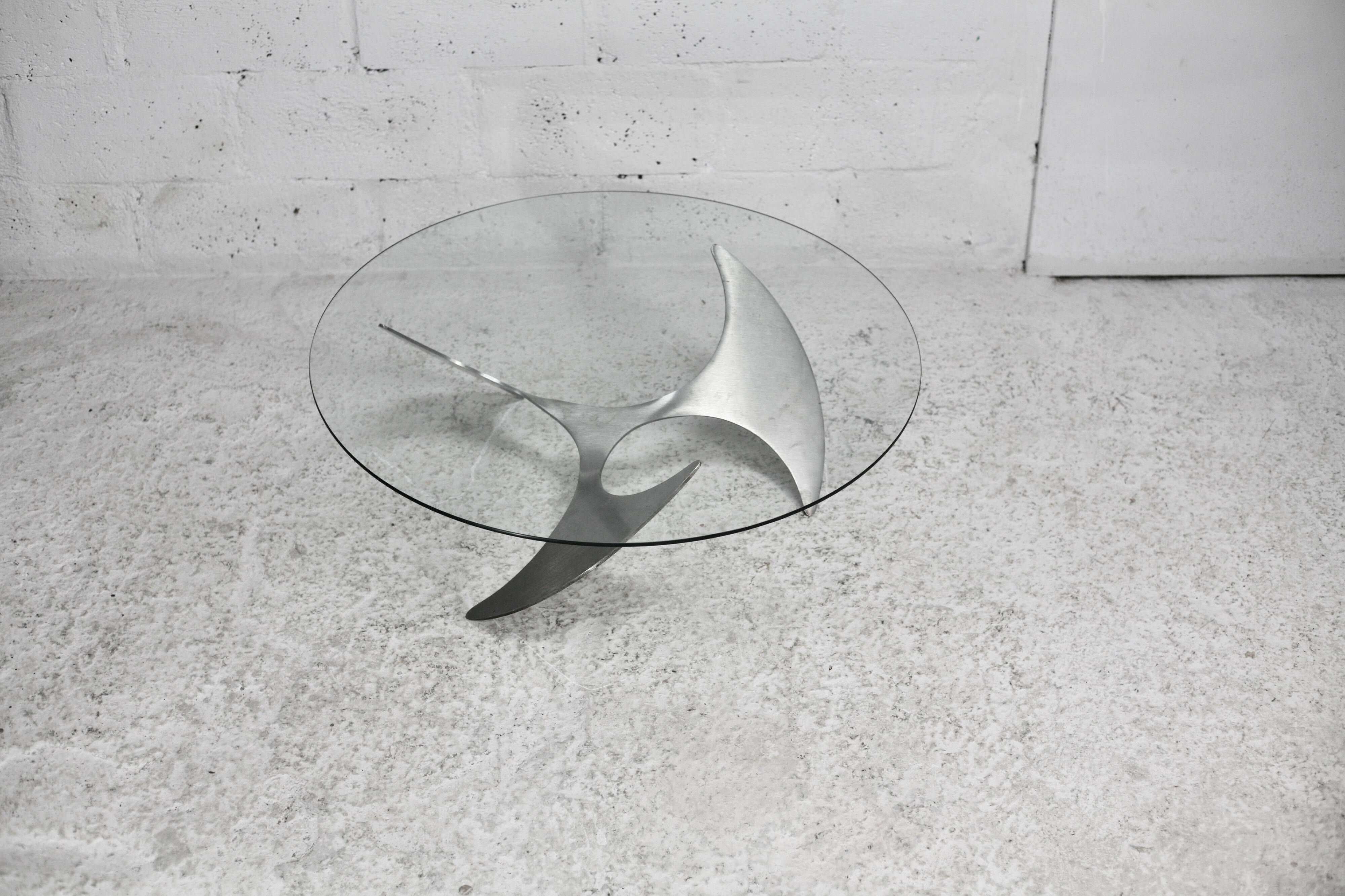 "space age" coffee table. Steel legs, glass slab. Circa 1970