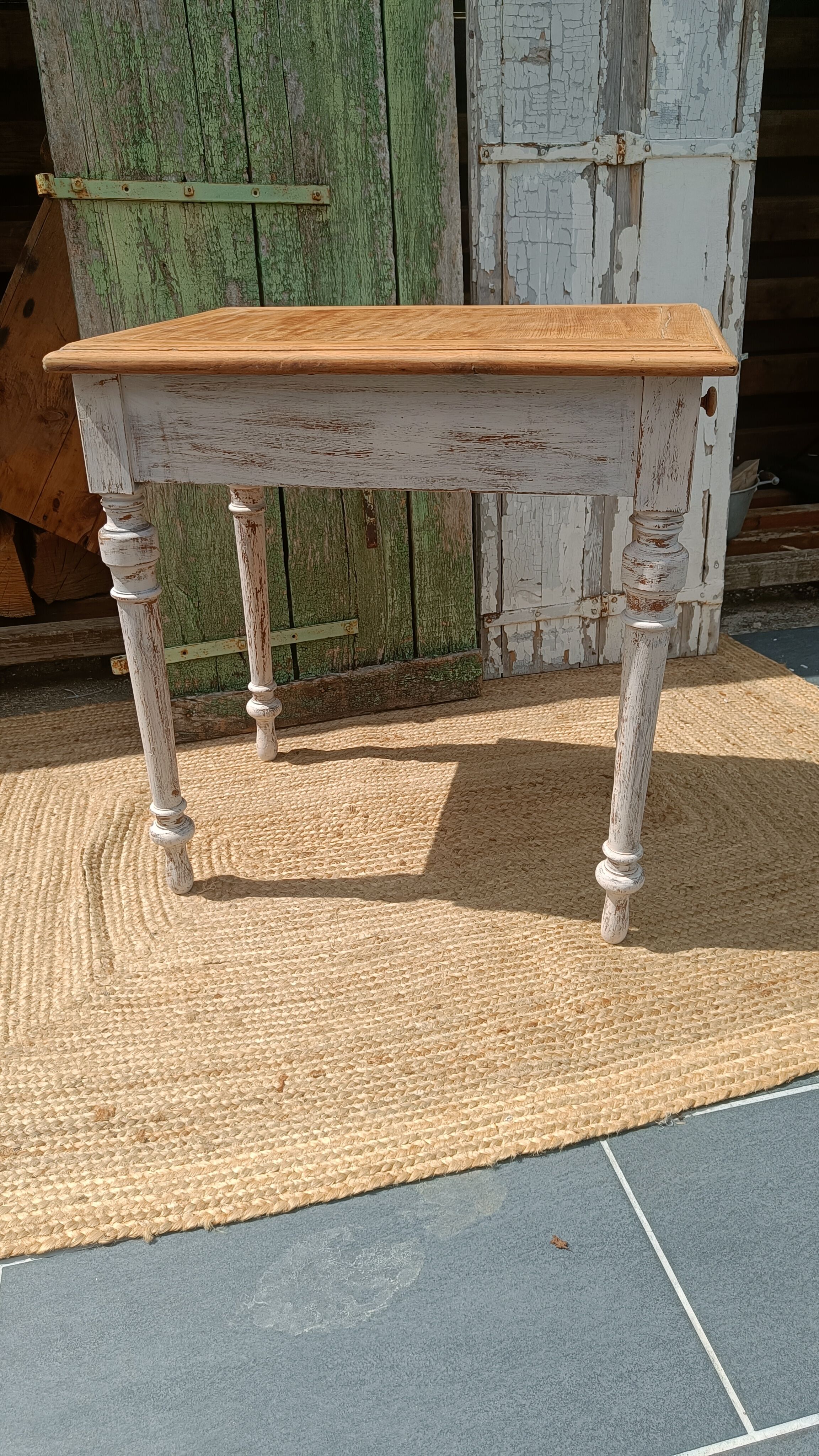 Antique drawer table with a patina.