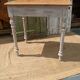 Antique drawer table with a patina.