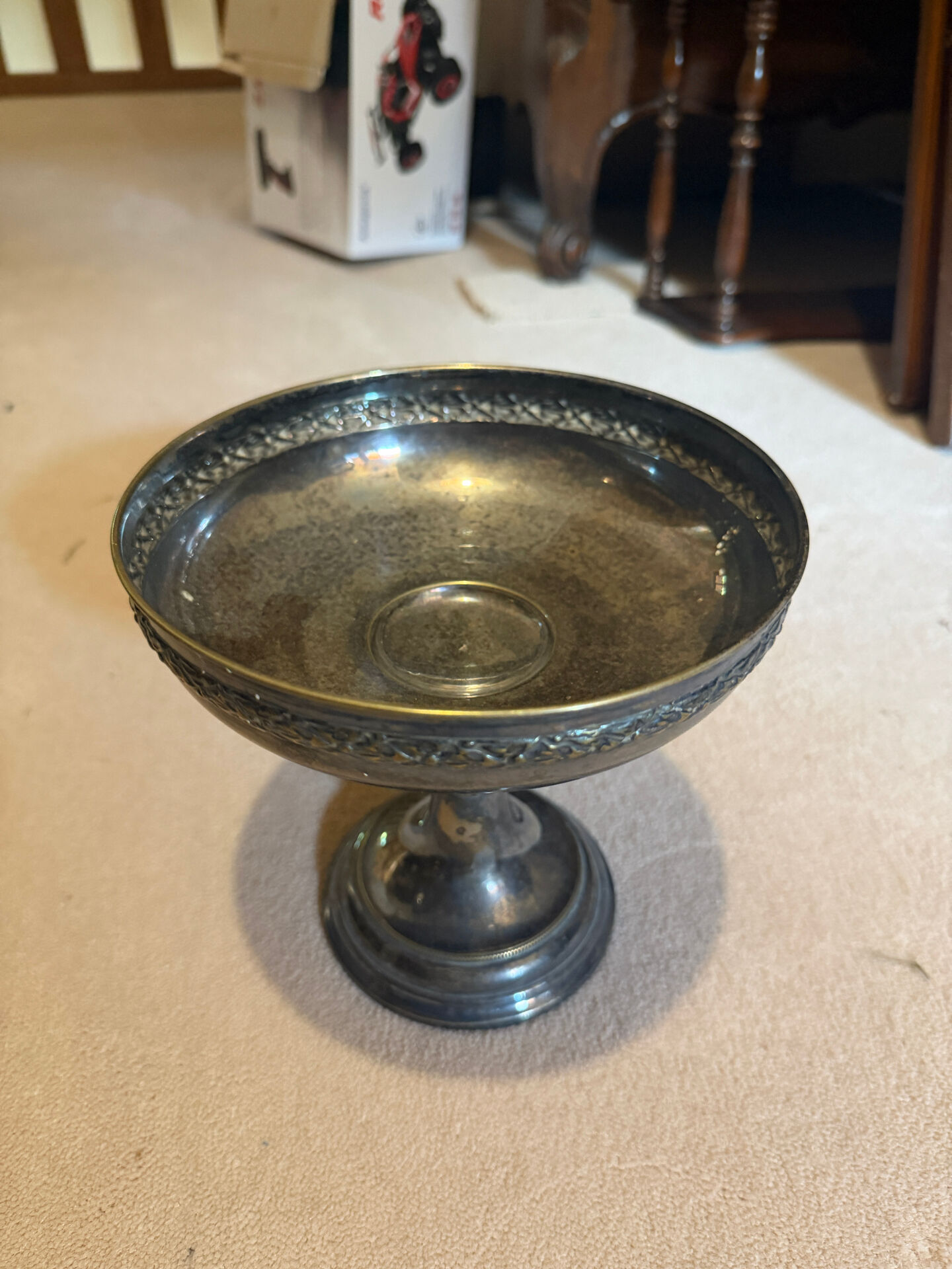 Vintage coupe on a patinated silver-plated metal stand.