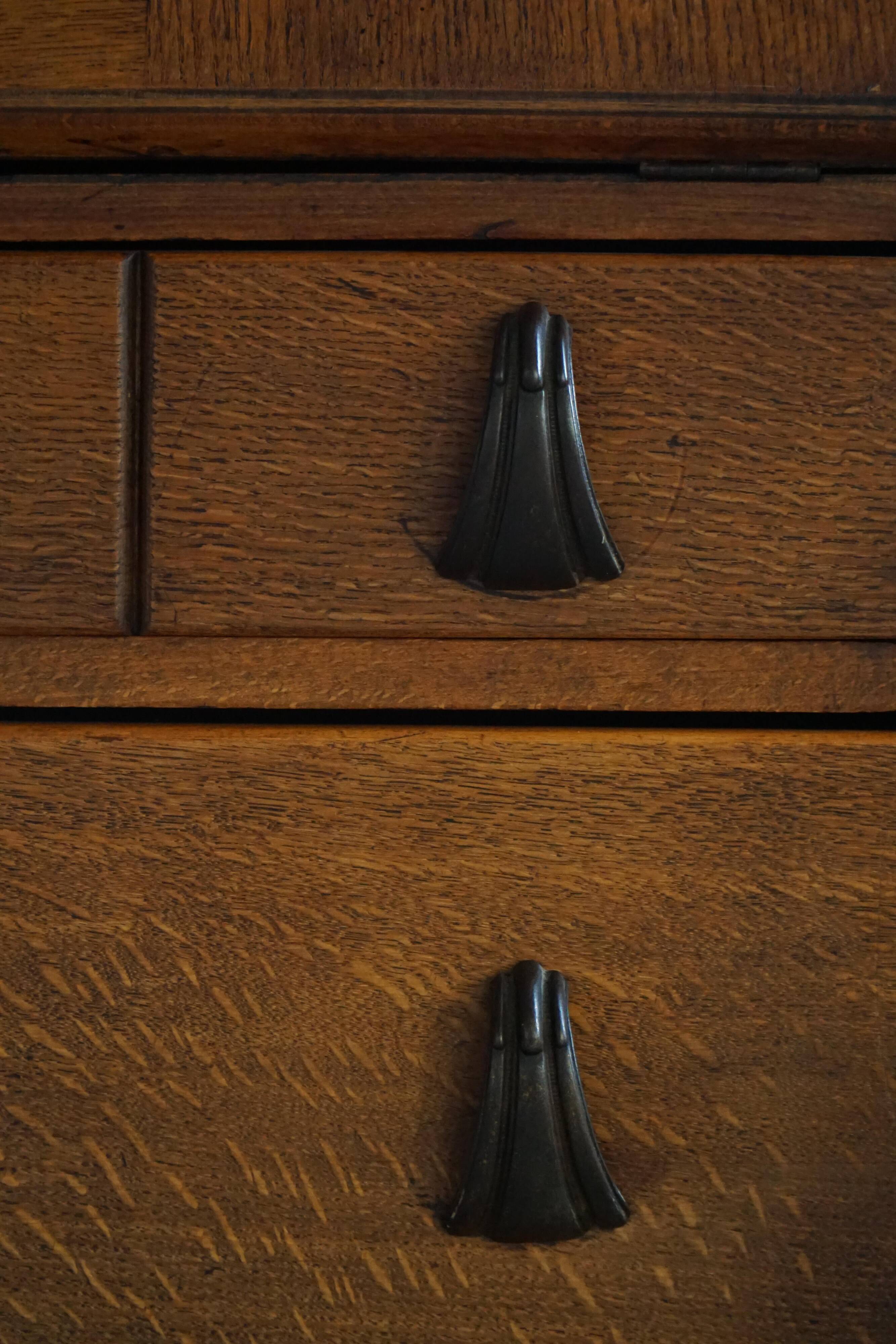 Desk / Chest of drawers in modern Danish oak from the early 20th century with shell handles.