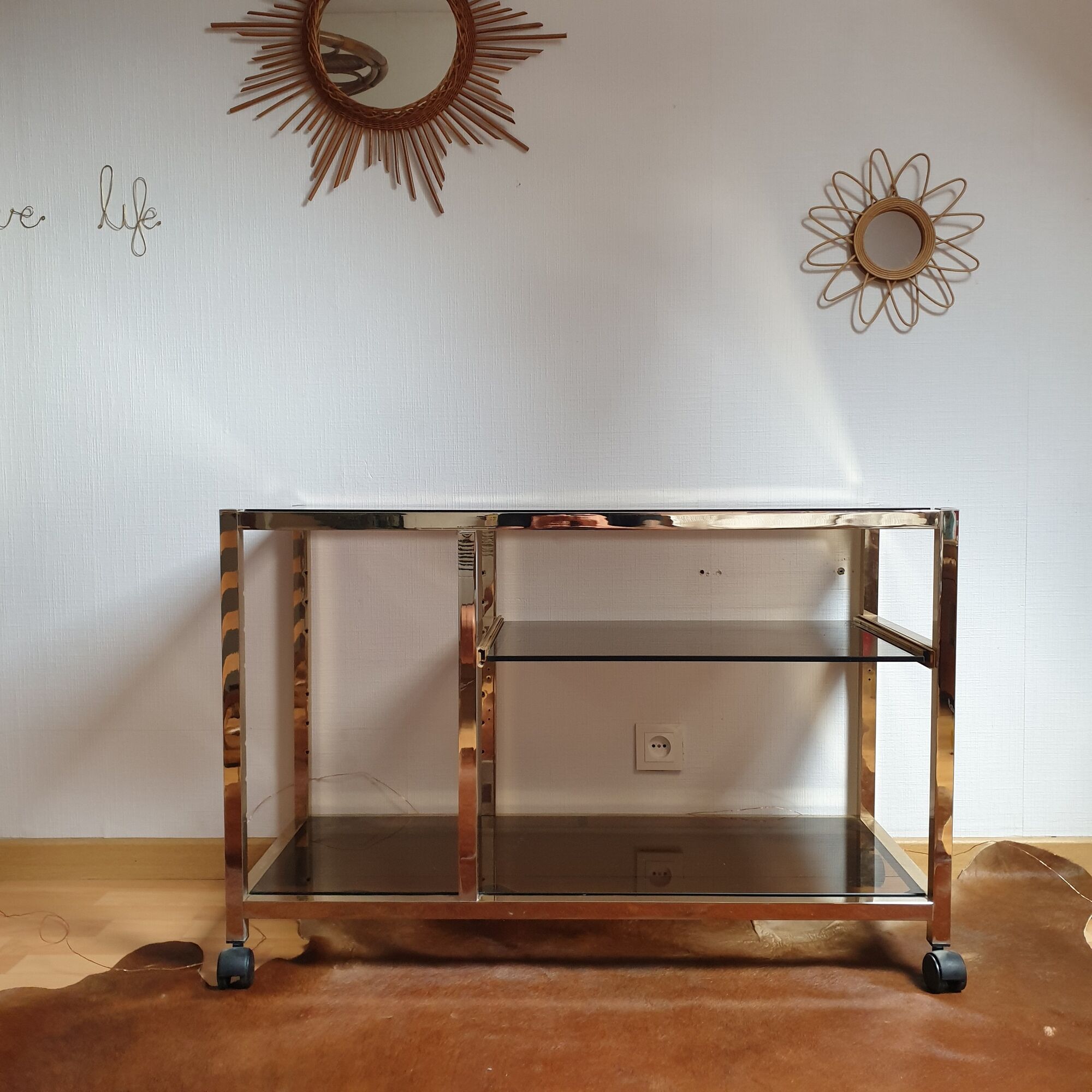 Service table with vintage brass wheels / smoked glass