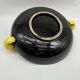 Large vintage black ceramic bowl with yellow parakeets, Vallauris.