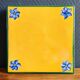 Yellow glazed ceramic trivet signed l. drimmer
