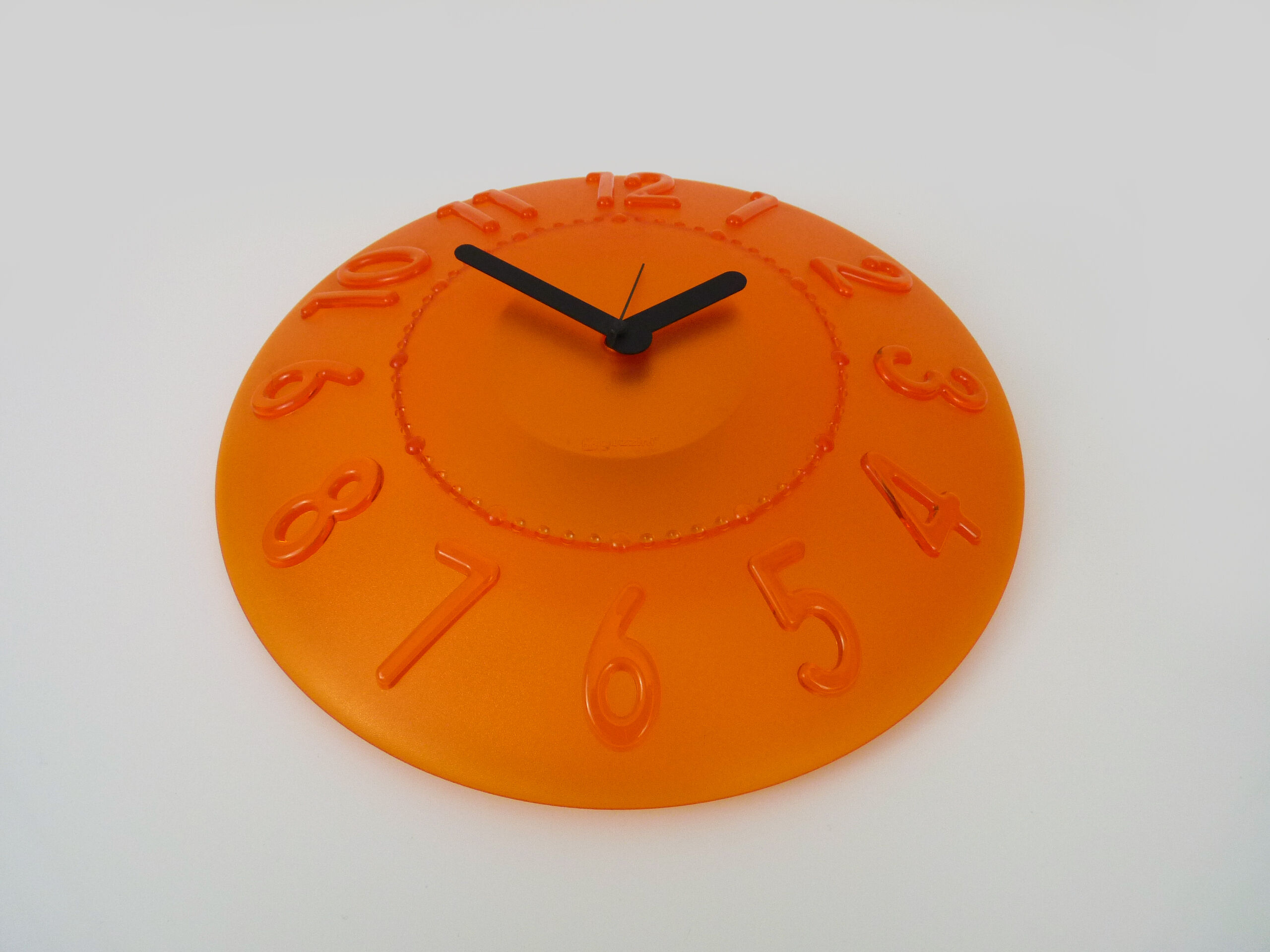 Guzzini orange wall clock from the 1980s