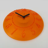 Guzzini orange wall clock from the 1980s