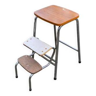 Folding stool in formica with a wood effect.