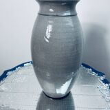 Handcrafted gray stoneware vase with child illustration