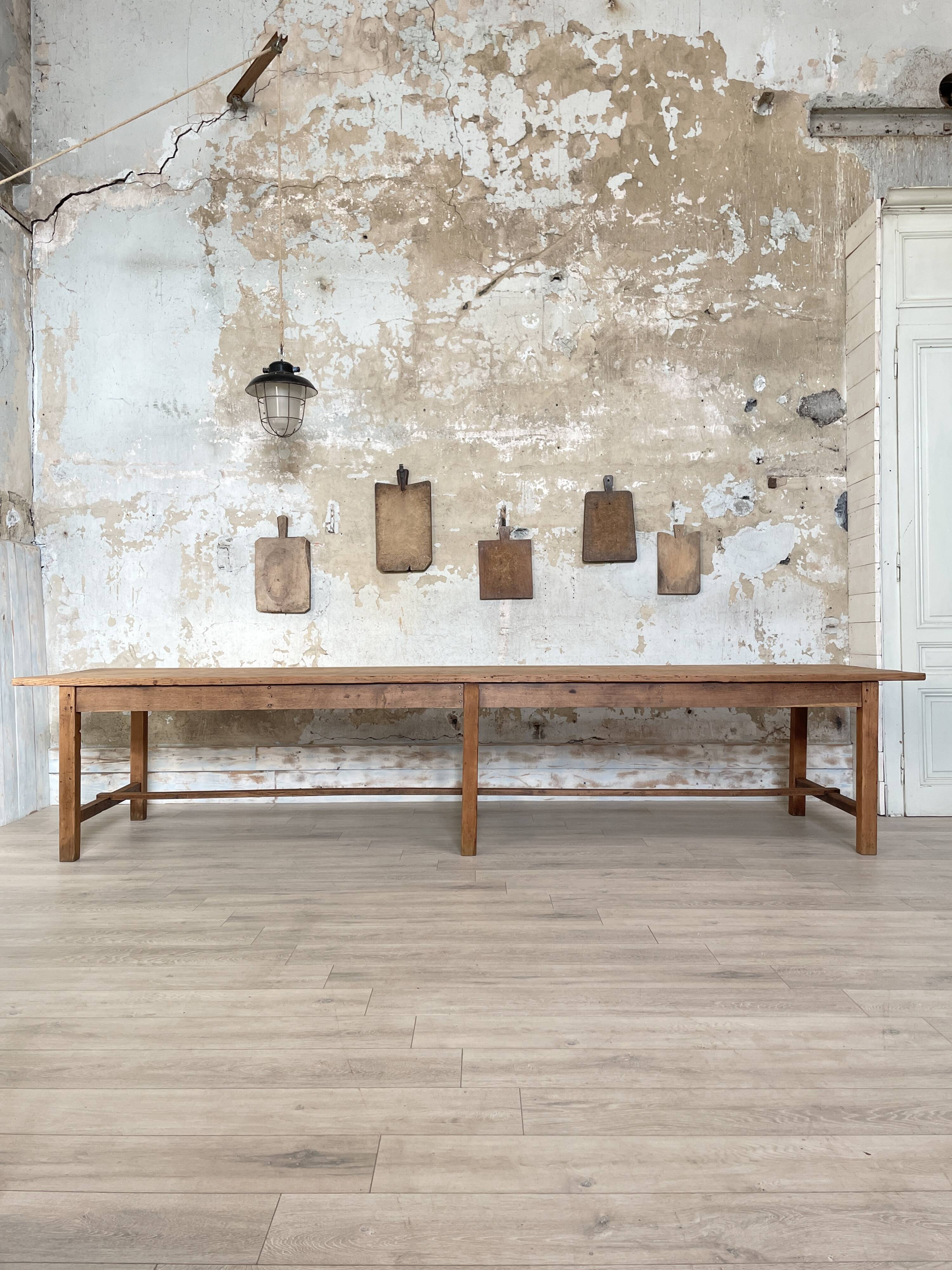 Solid wood workshop table with straight legs.