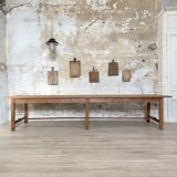 Solid wood workshop table with straight legs.